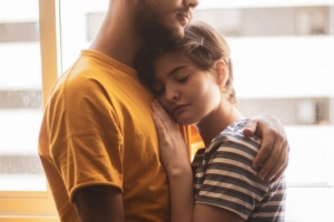 young couple embrace